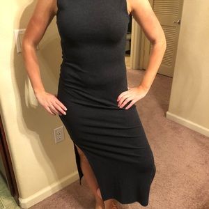 Ankle length navy blue dress with thigh-high slit.